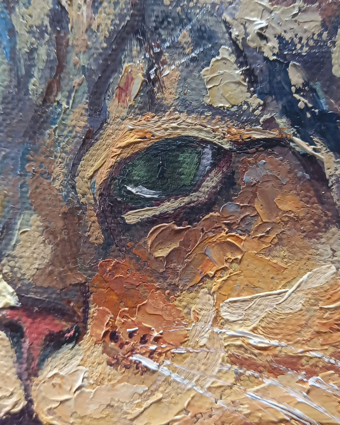 Detail of the cat’s eye and surrounding paint surface.