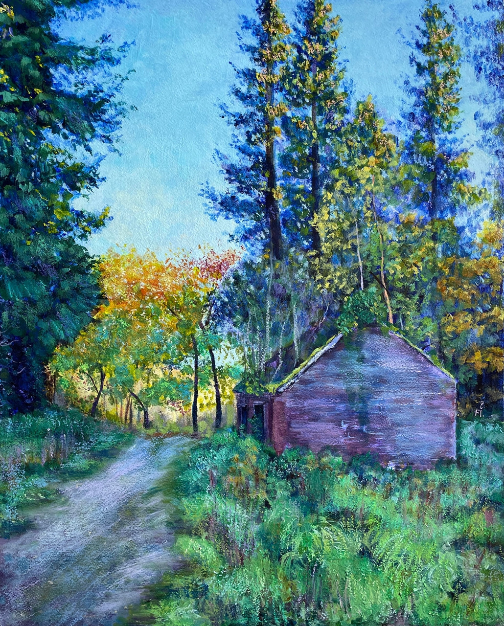 An autumn path passing a quiet, weathered building beneath tall trees.